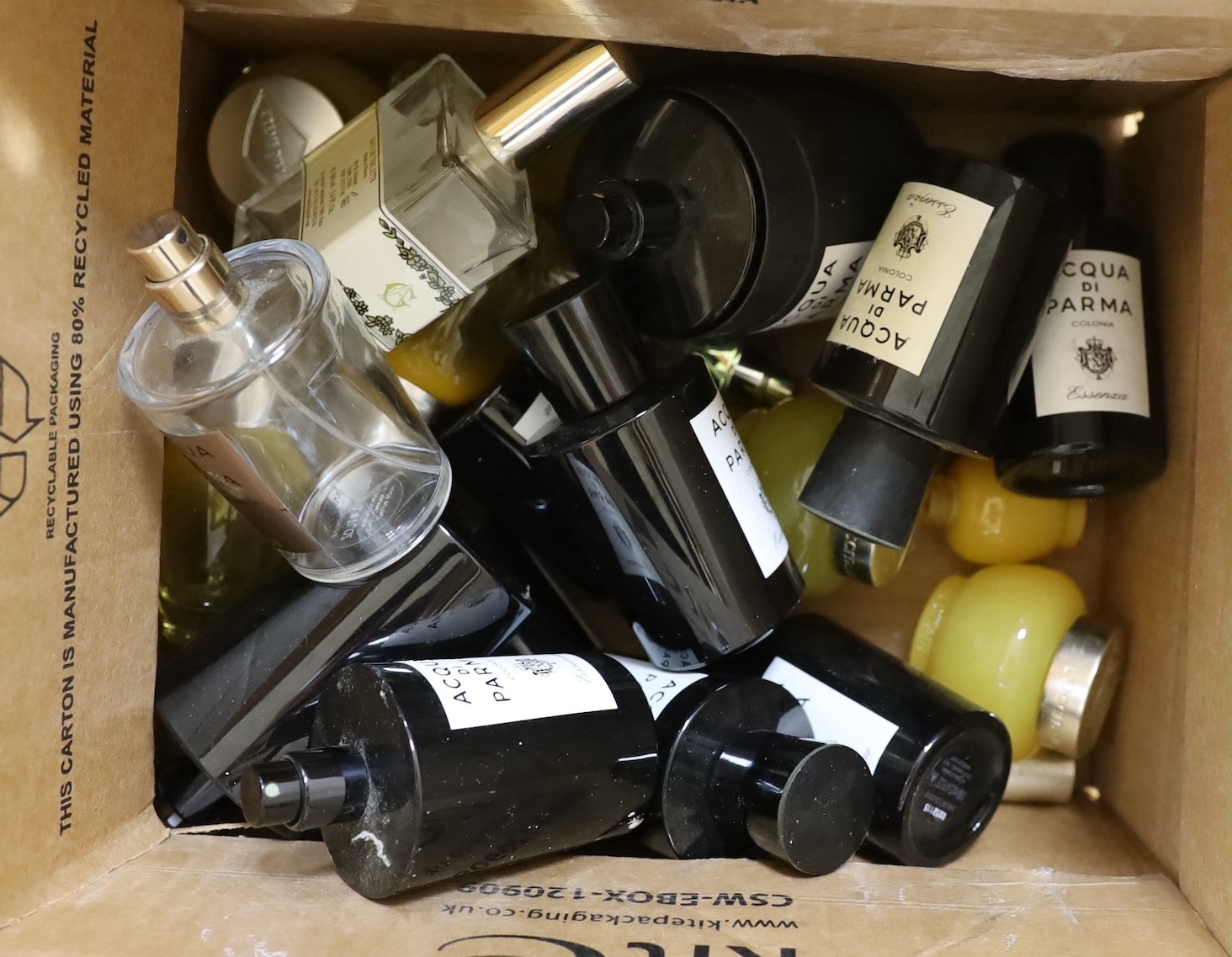 A collection of Jo Malone and Acqua Di Parma glass scent bottles